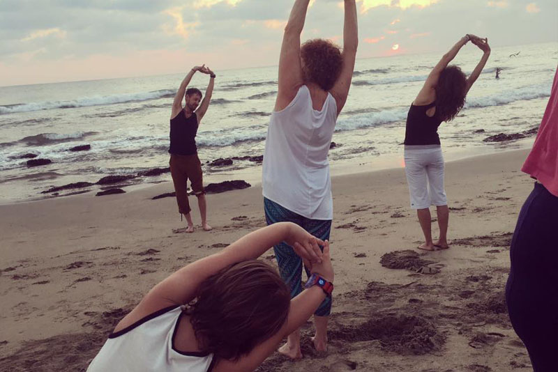 Yoga in Bali by the beach on sunset